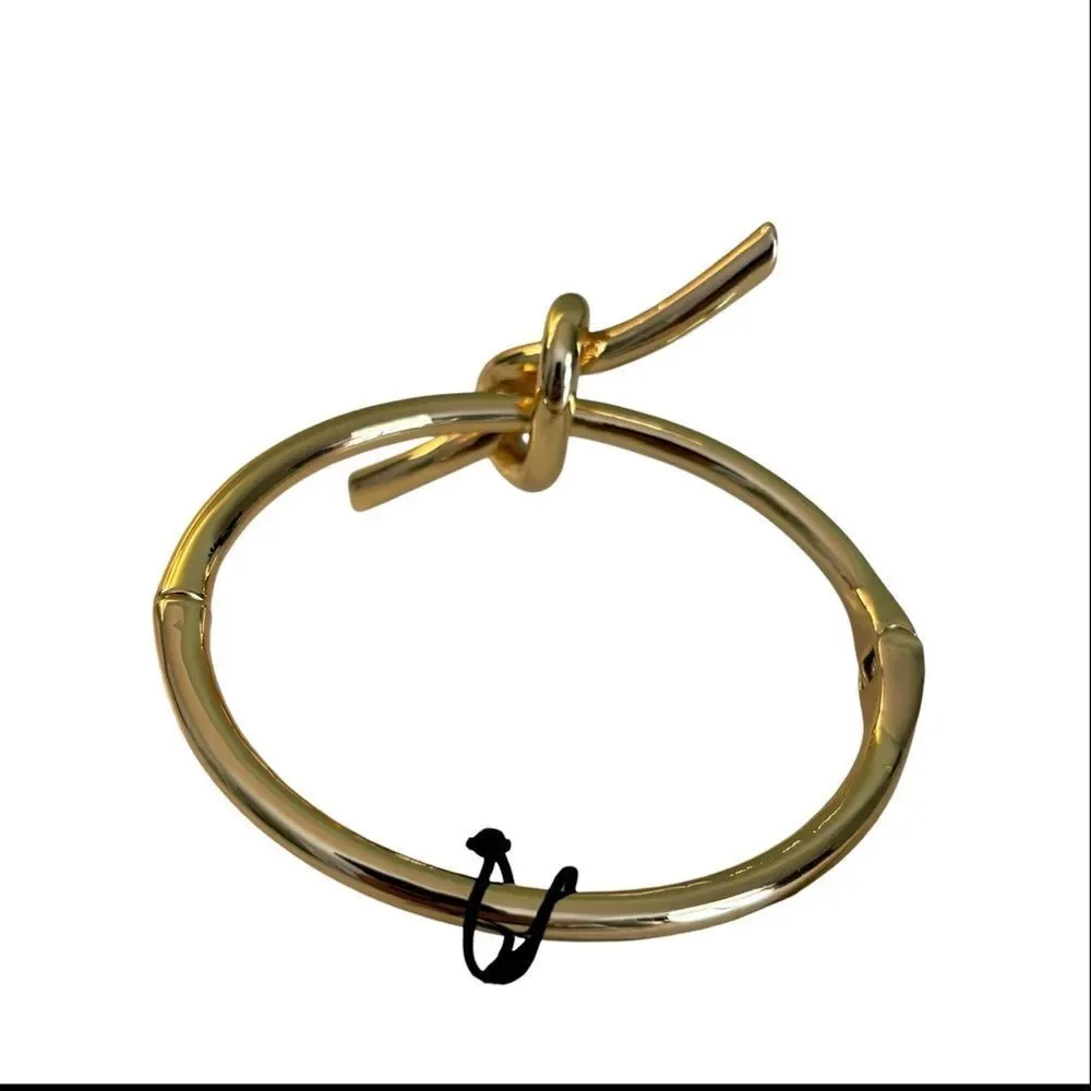 Song of Style Gold Tone Knot Cuff Bracelet.